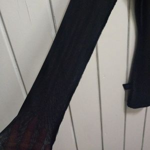 Black v neck with fine mess long sleeves.